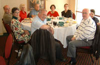 Paul Rasanen, Barb Simpson Alexander, Penny's spouse, Penny Richardson Schmidt, Forrest Behrens, Forrest's spouse Jacque, Connie Alshouse Anderson, Chuck Stewart, (behind Chuck) Kathy Donohue Stewart. 